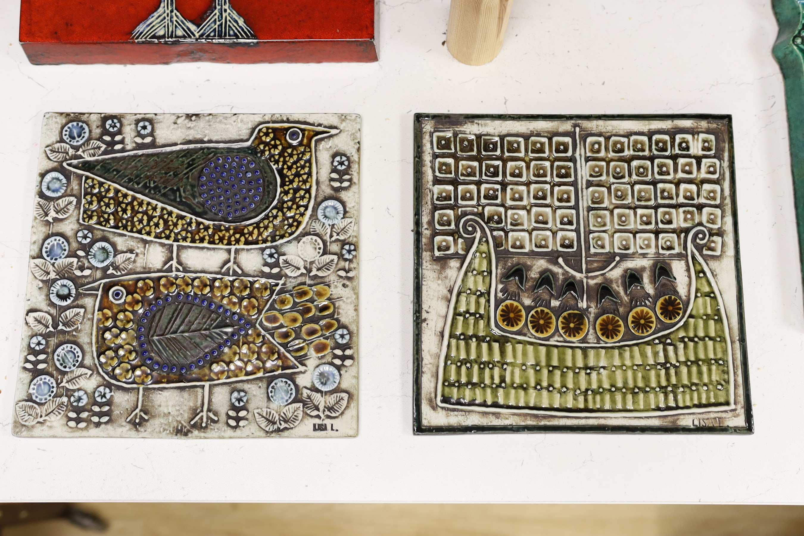 A pair of large Gustavsberg Lisa Larsson plaques decorated with birds and flowers and four other smaller plaques, largest 43x31cm